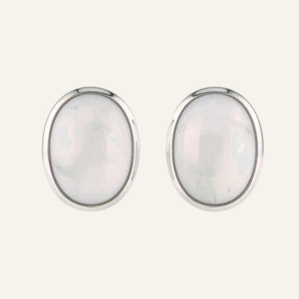 Cream Mother of Pearl Oval Stud Earrings in Sterling Silver, shown on a cream background