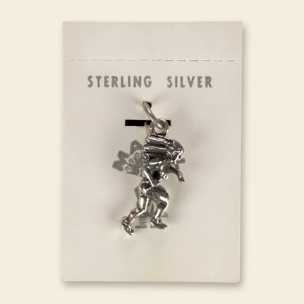 Dancer in Headdress Charm in Sterling Silver, Vintage Maisel's New Old Stock, shown on an ivory background