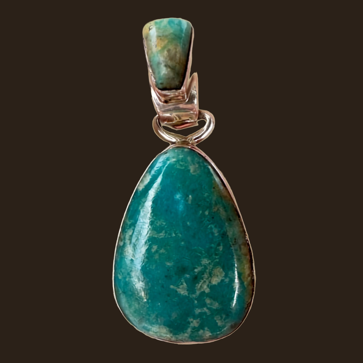 Fox Turquoise Teardrop Pendant in Sterling Silver, by Martinez, shown on an espresso background