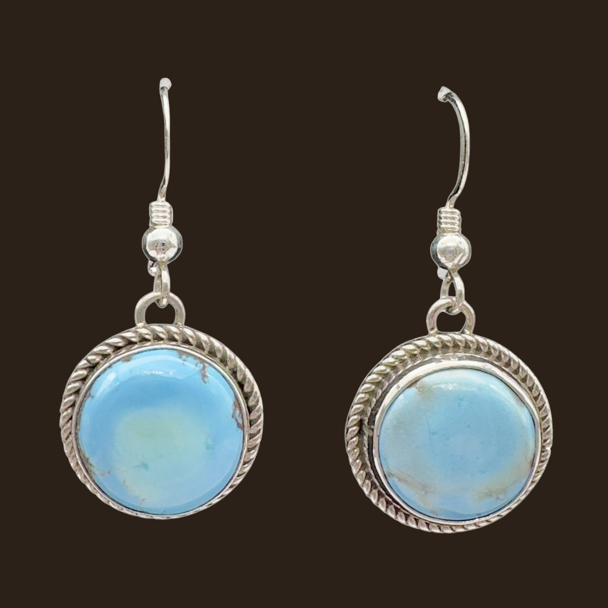 Golden Hills Turquoise Earrings in Sterling Silver, shown on an espresso background