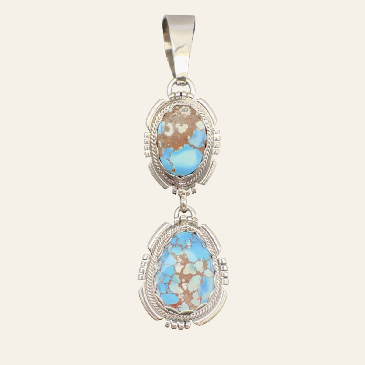 Golden Hills Turquoise Pendant Necklace in Navajo Sterling Silver, by Randy Billy, shown on a cream background