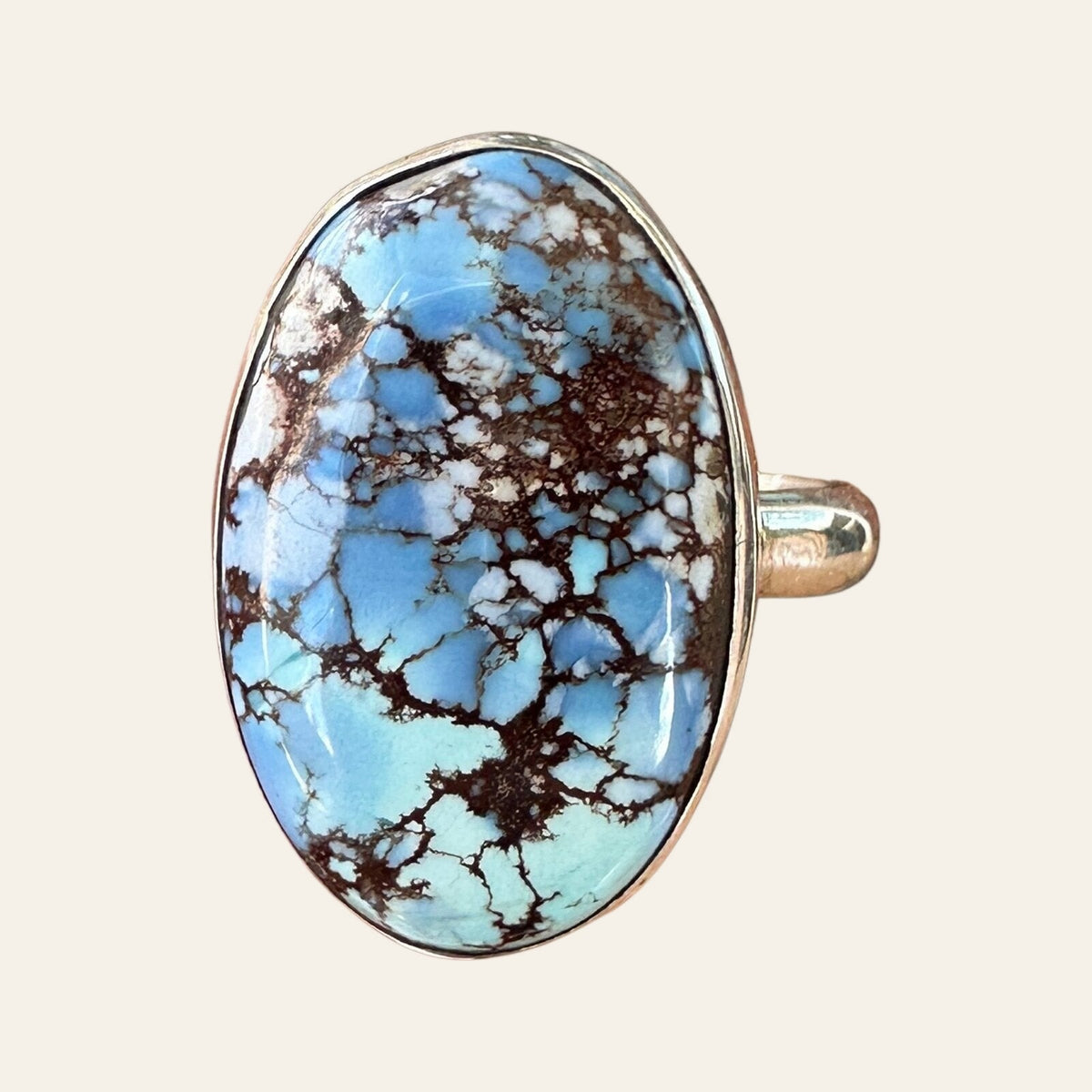 Golden Hills Turquoise Ring in Sterling Silver, Size 7, shown on a cream background