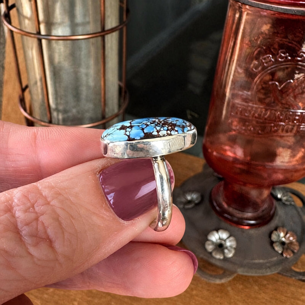 Side profile of the Golden Hills turquoise ring showing the sterling silver bezel setting and band
