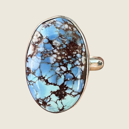 Golden Hills turquoise ring in sterling silver, close-up of the pale powder blue oval cabochon with fine brown matrix