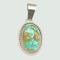 Kingman Red Web Turquoise Oval Pendant in Navajo Sterling Silver, shown on a sage mist background