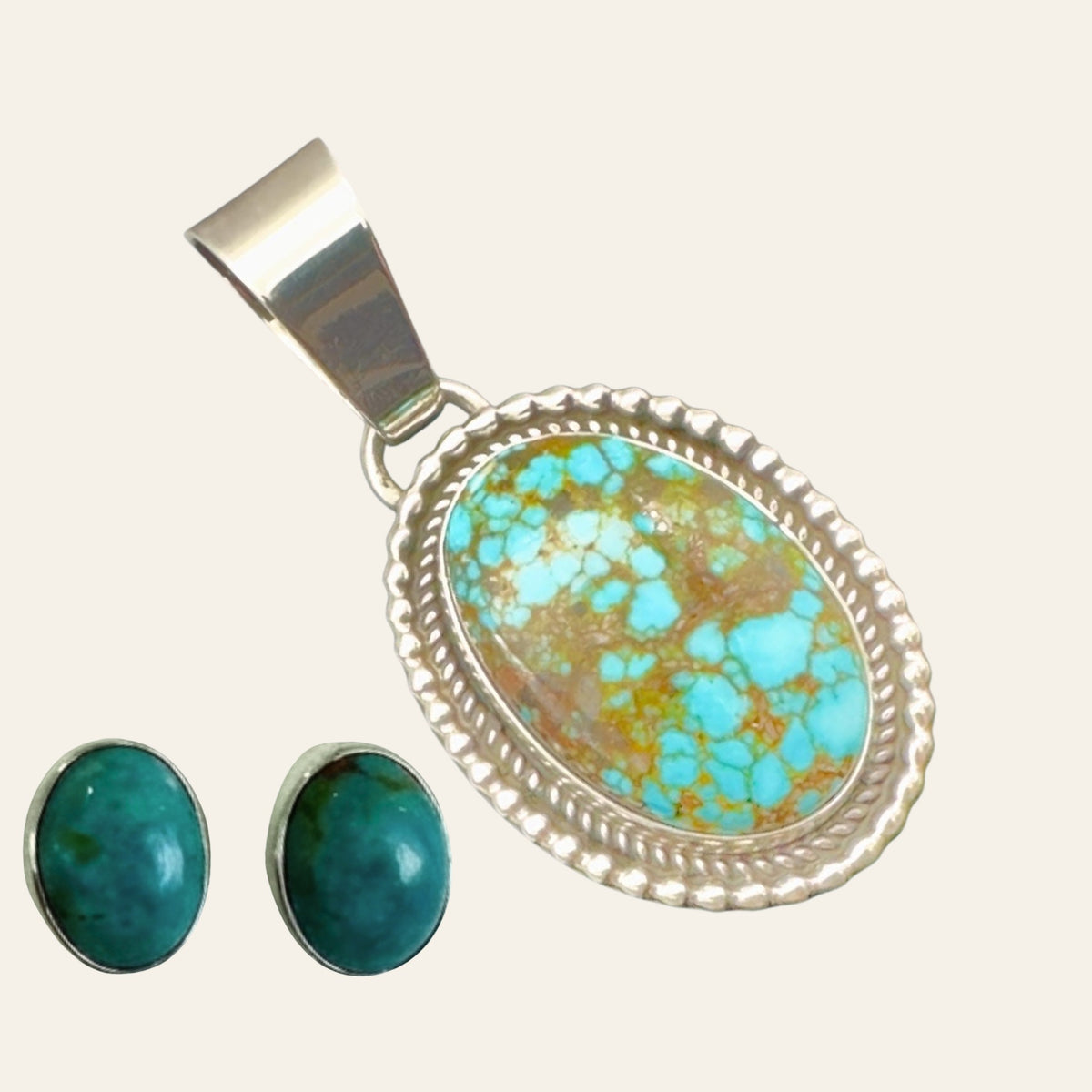 Kingman Red Web Turquoise Pendant and Oval Stud Earrings in Sterling Silver (SET), shown on a cream background