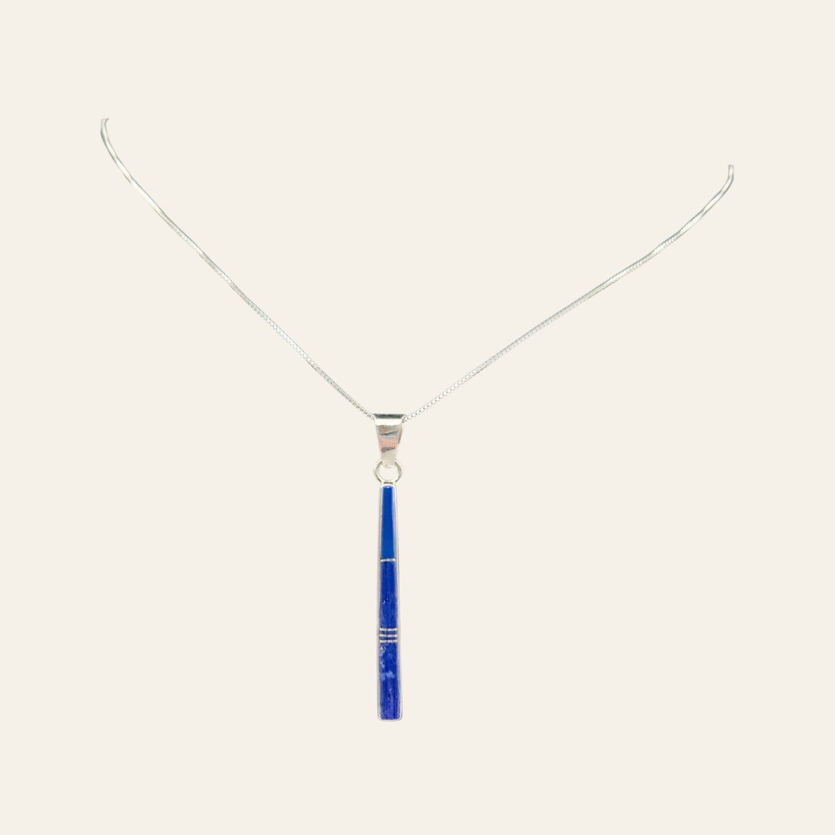 Lapis Lazuli Necklace in Sterling Silver, by Rick Tolino, shown on a cream background