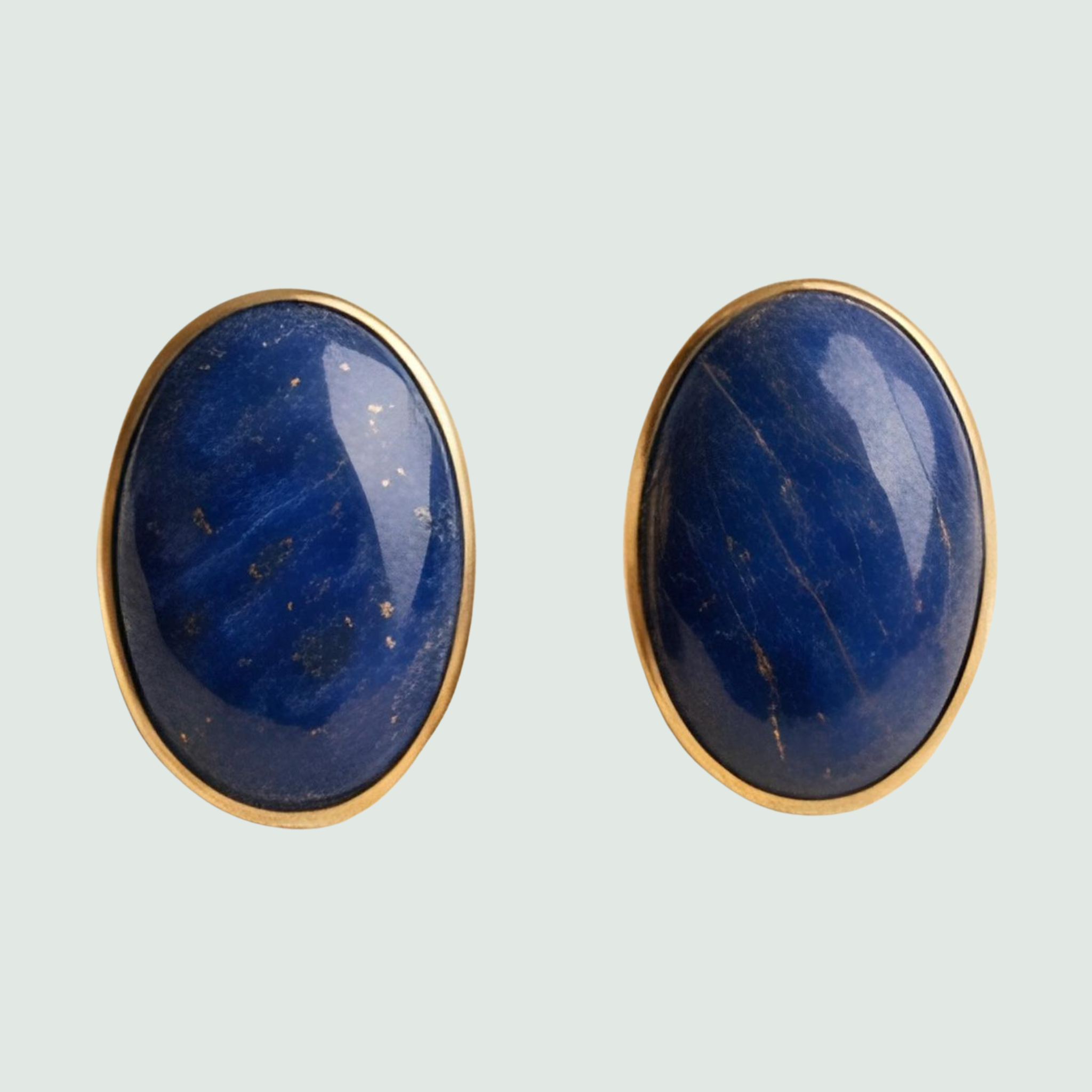 Lapis Lazuli Oval Stud Earrings in Solid 14K Gold, shown on a sage mist background