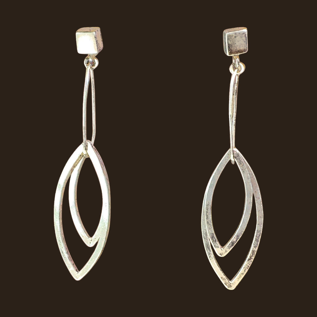 Leaf Dangle Earrings in Sterling Silver, by Grace Chin, shown on an espresso background
