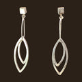 Leaf Dangle Earrings in Sterling Silver, by Grace Chin, shown on an espresso background