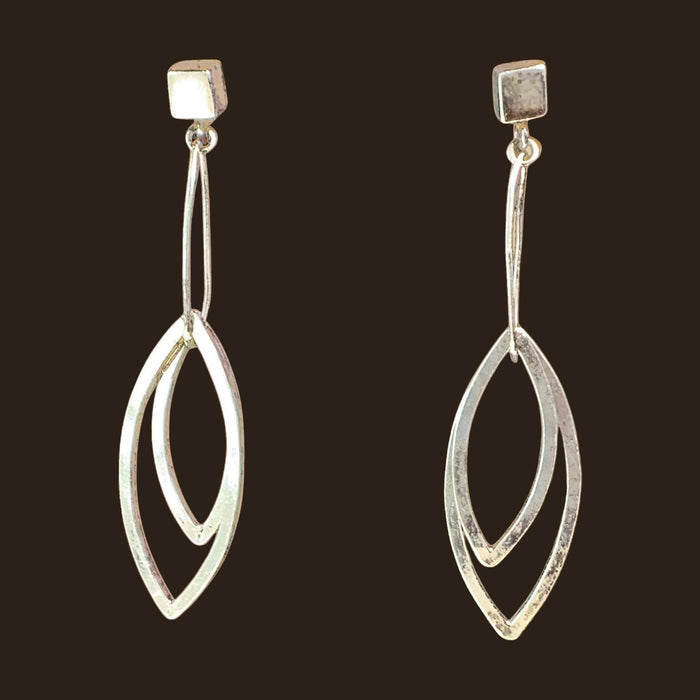 Leaf Dangle Earrings in Sterling Silver, by Grace Chin, shown on an espresso background