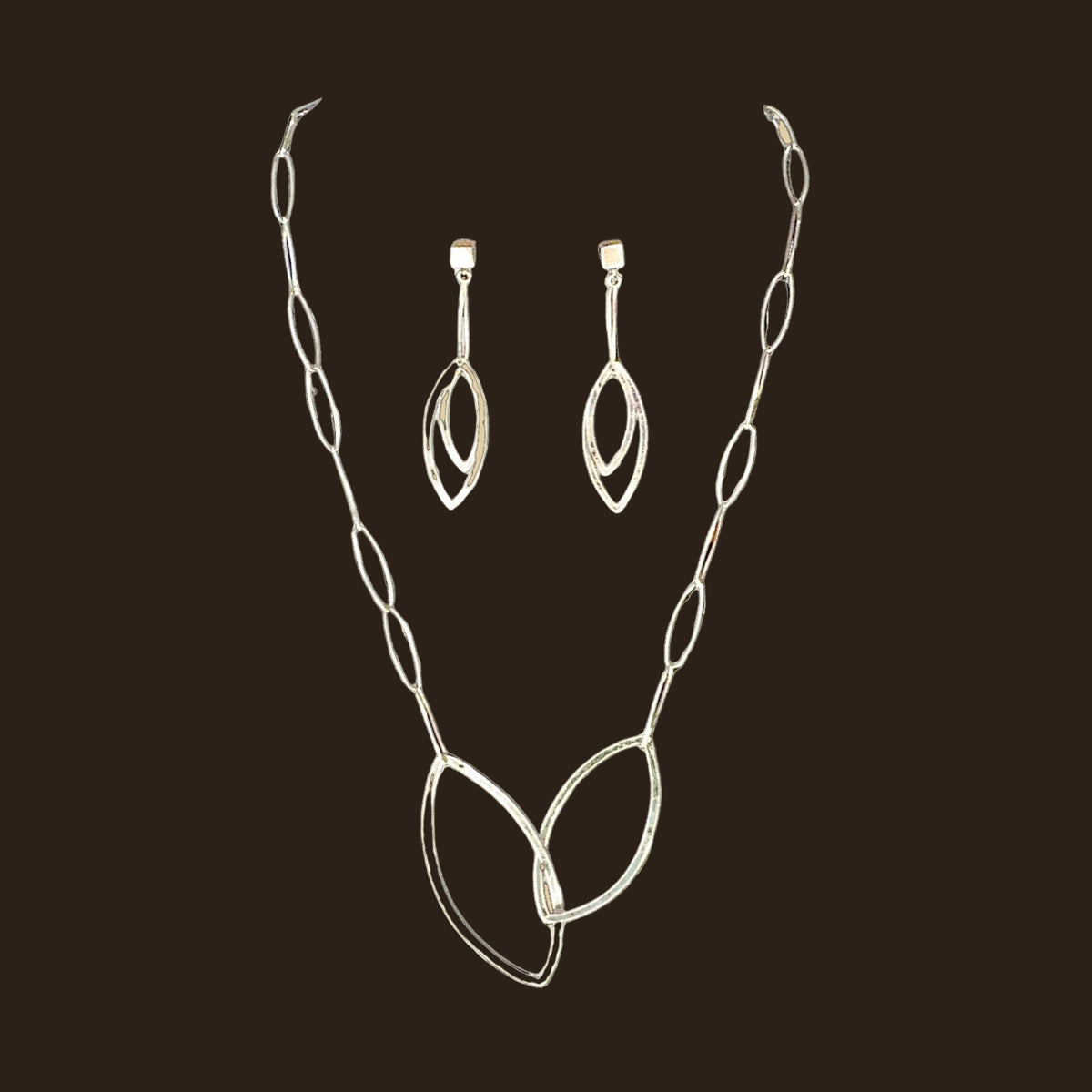 Leaf Necklace and Earrings in Sterling Silver, by Grace Chin (SET), shown on an espresso background