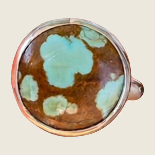 Number 8 turquoise ring in sterling silver, size 7.25, shown on a bone linen background