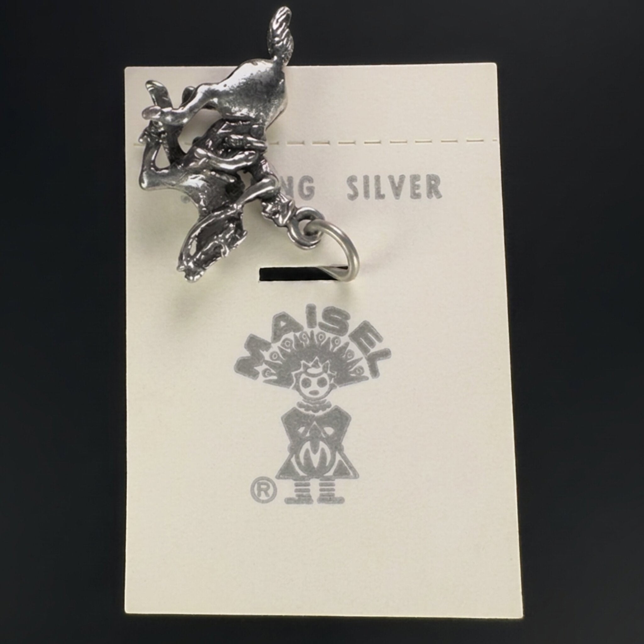 Reverse of the vintage Maisel's sterling silver bucking bronco charm