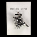 Vintage Maisel's sterling silver bucking bronco charm with rider on its original trading post card