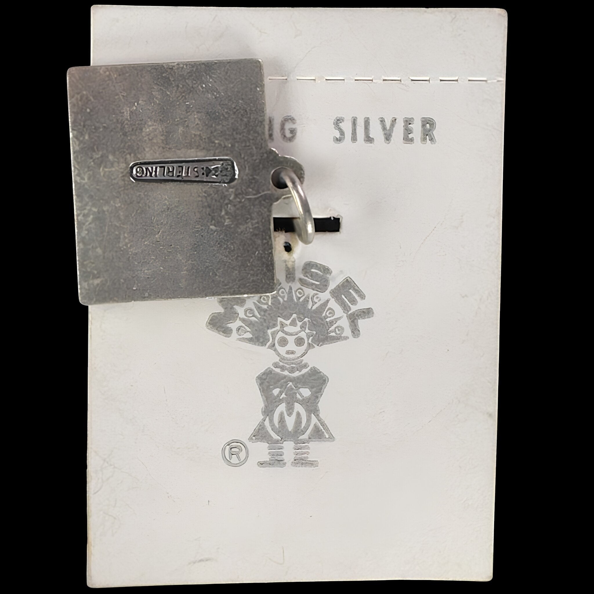 Reverse of the vintage Maisel's Colorado state charm showing the sterling stamp