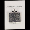 Vintage Maisel's sterling silver Colorado state map charm on its original trading post card