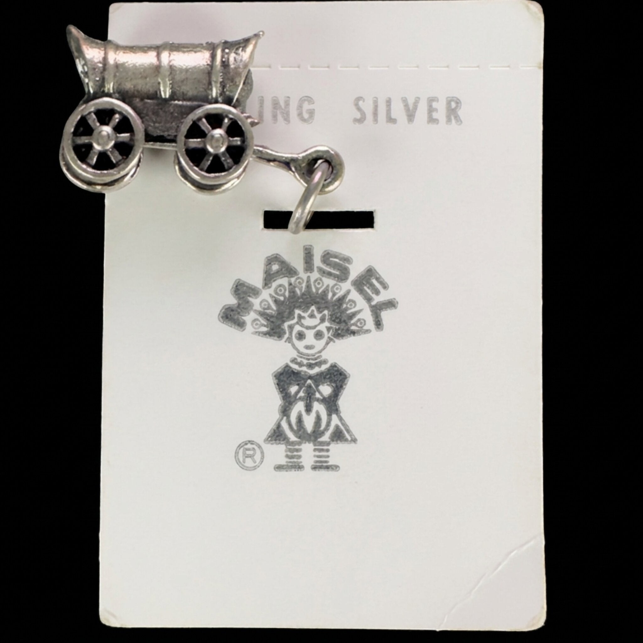 Reverse of the vintage Maisel's sterling silver covered wagon charm