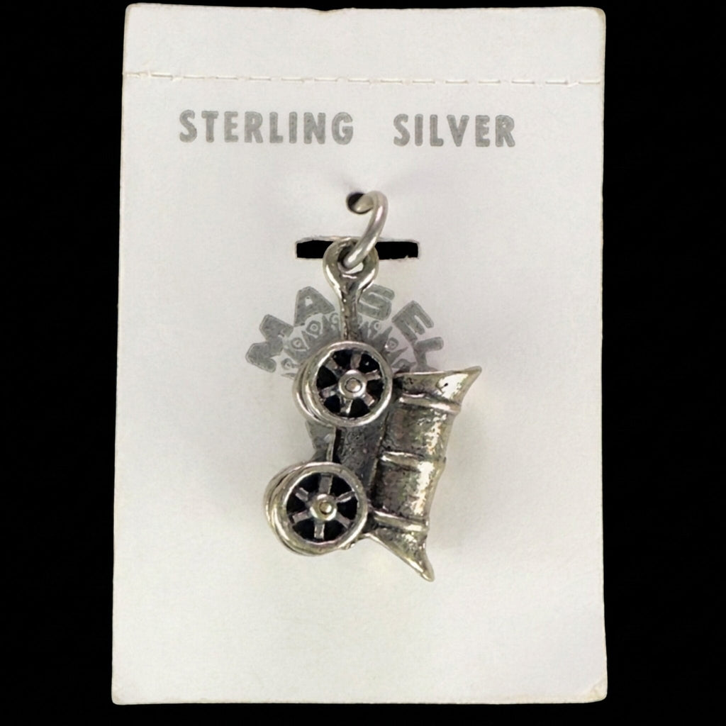 Vintage Maisel's sterling silver covered wagon charm on its original trading post card