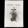 Vintage Maisel's sterling silver covered wagon charm on its original trading post card