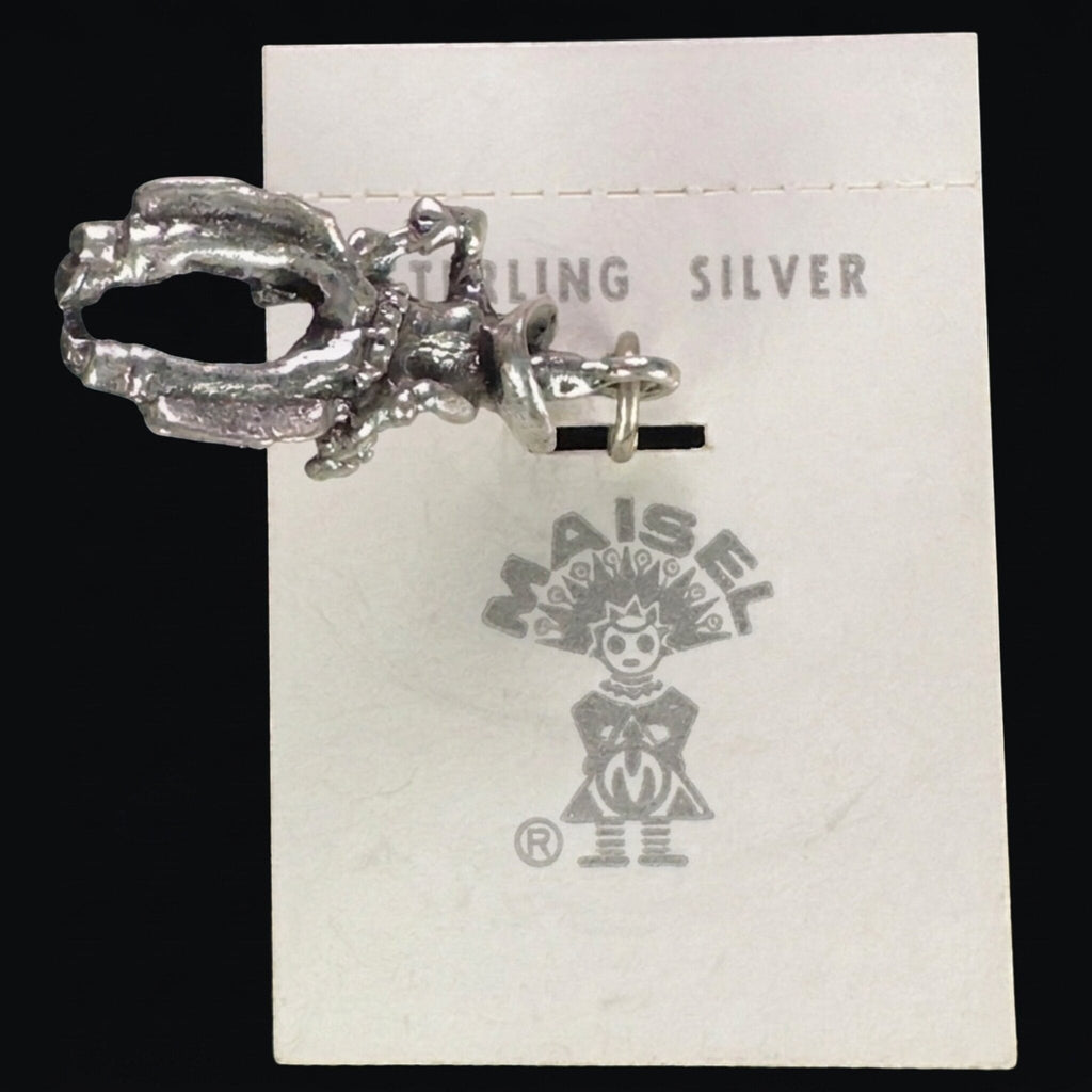 Reverse of the vintage Maisel's sterling silver cowboy charm