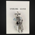 Vintage Maisel's sterling silver cowboy charm in woolly chaps on its original trading post card