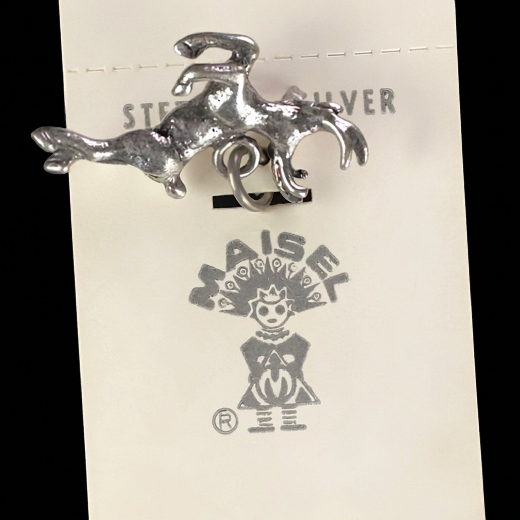 Reverse of the vintage Maisel's sterling silver leaping elk charm