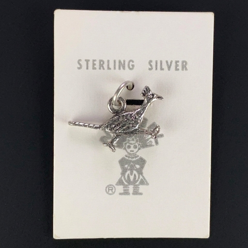 Vintage Maisel's small textured sterling silver roadrunner charm on its original trading post card