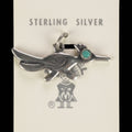 Vintage Maisel's sterling silver roadrunner charm with a turquoise eye on its original trading post card