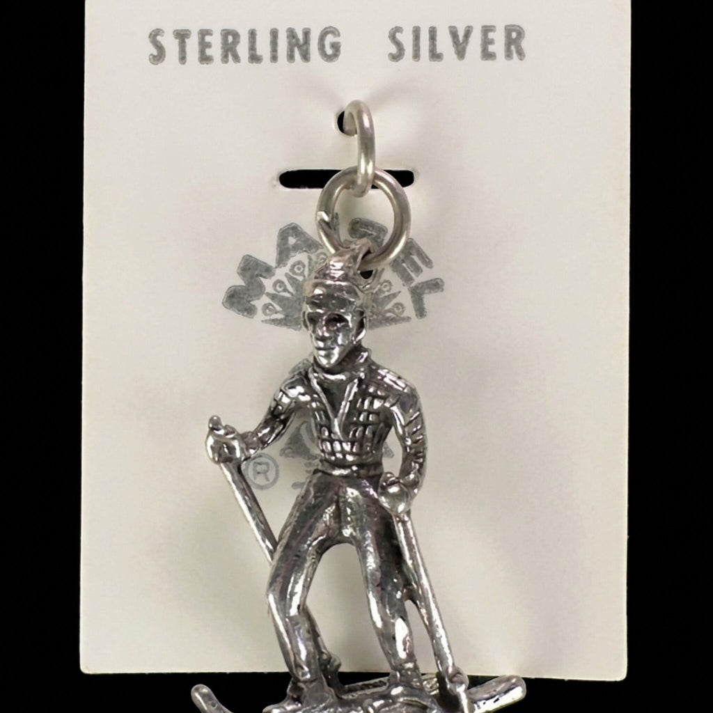Vintage Maisel's sterling silver skier charm on its original trading post card