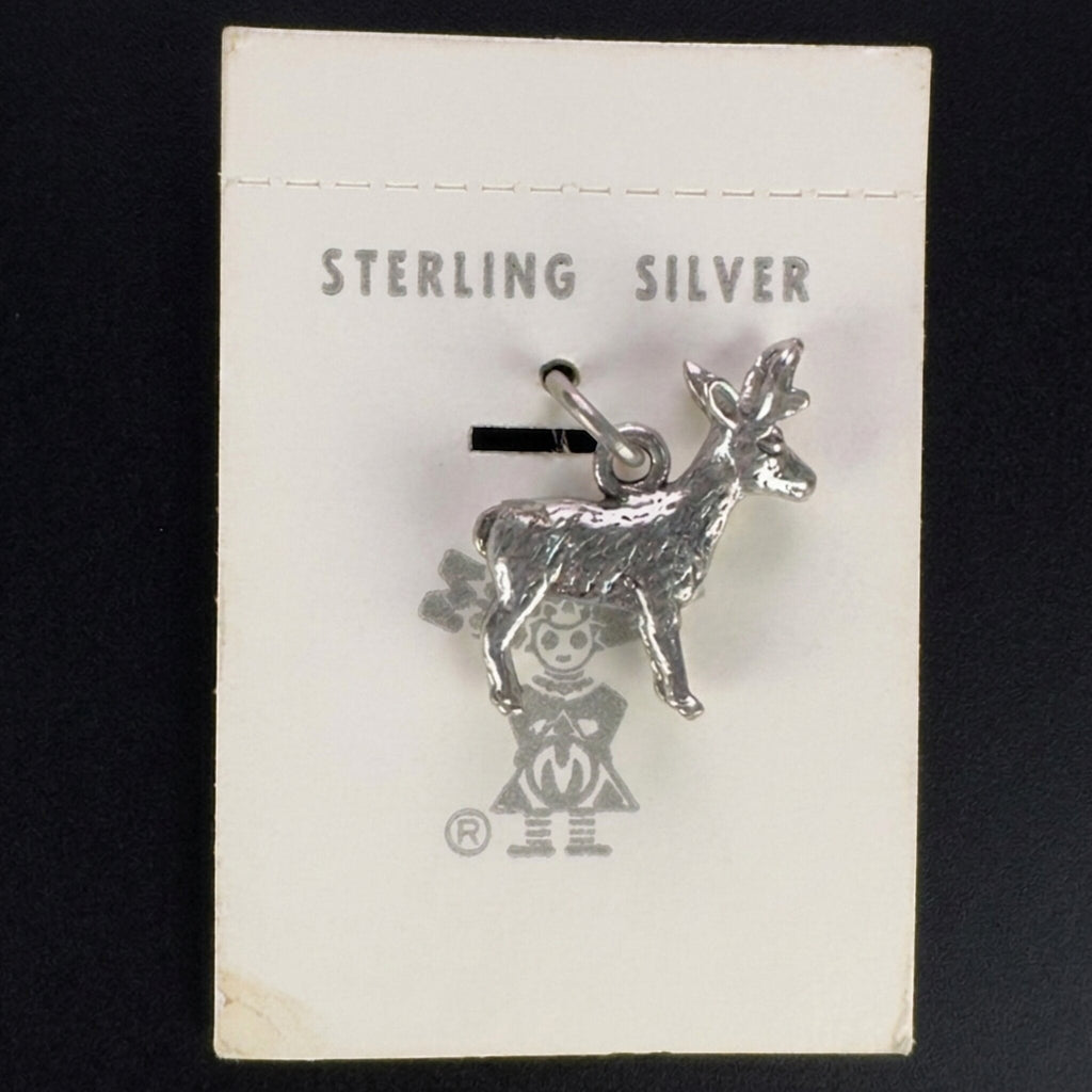 Vintage Maisel's sterling silver standing elk charm on its original trading post card