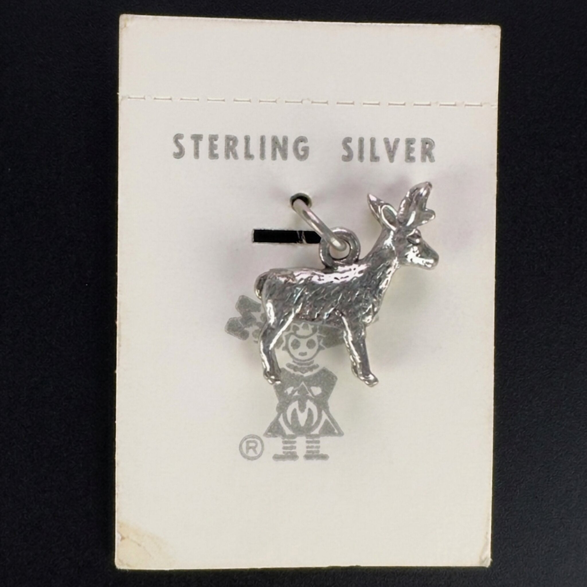 Vintage Maisel's sterling silver standing elk charm on its original trading post card