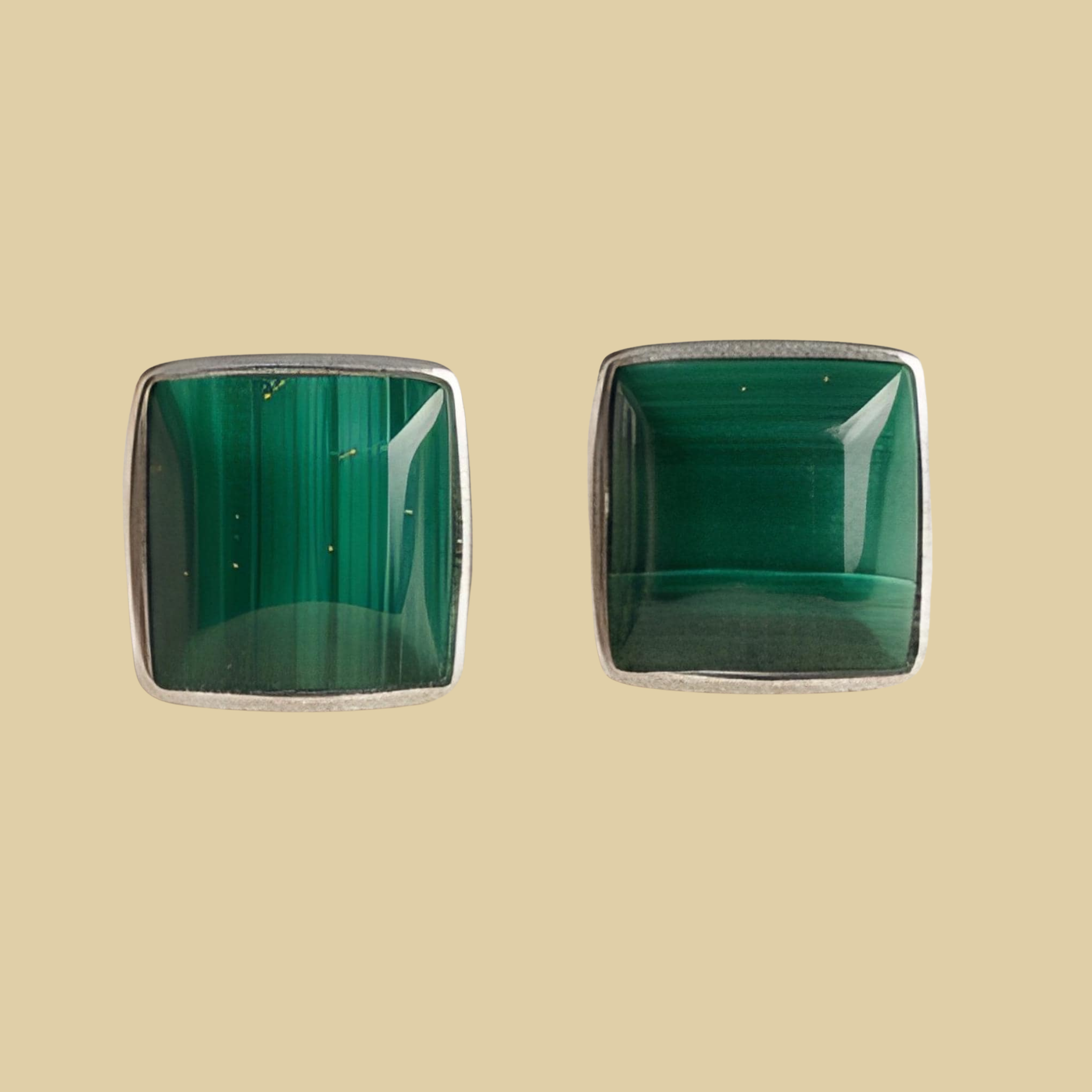 Malachite Square Stud Earrings in Sterling Silver, shown on a desert plaster background