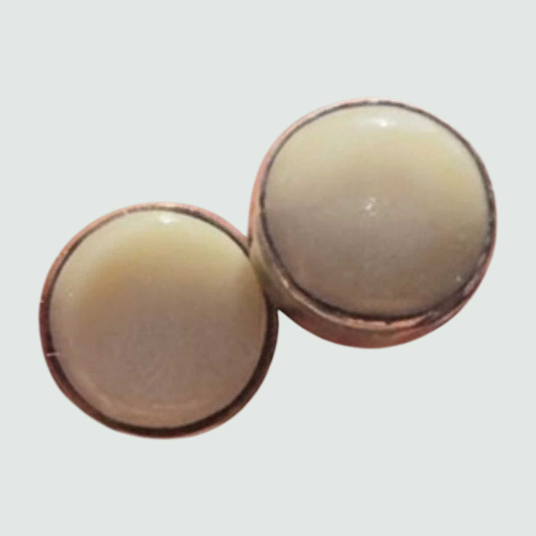 Mother of Pearl Round Stud Earrings in Sterling Silver, shown on a sage mist background