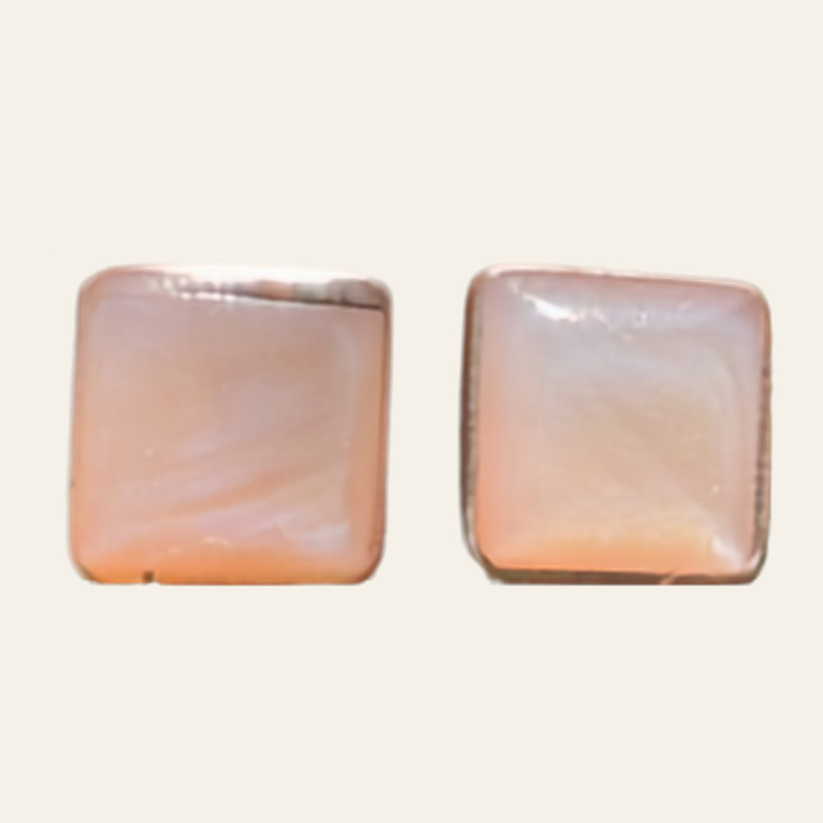 Mother of Pearl Square Stud Earrings in Sterling Silver, shown on a cream background