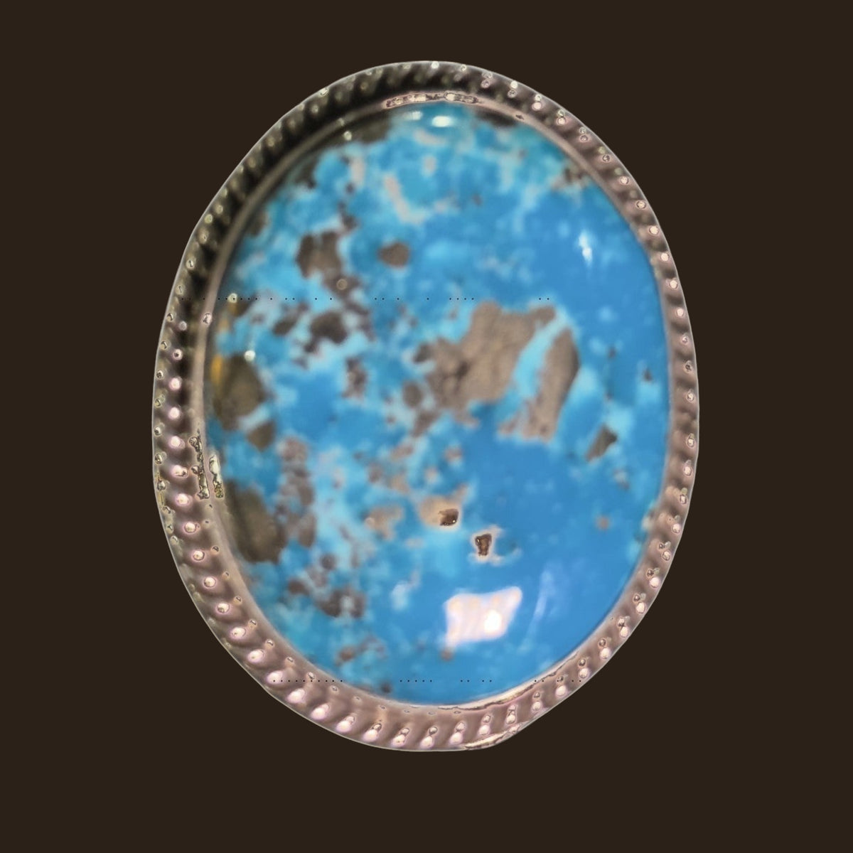 Nacozari Turquoise Statement Ring in Navajo Sterling Silver, by P. Yazzie, shown on an espresso background
