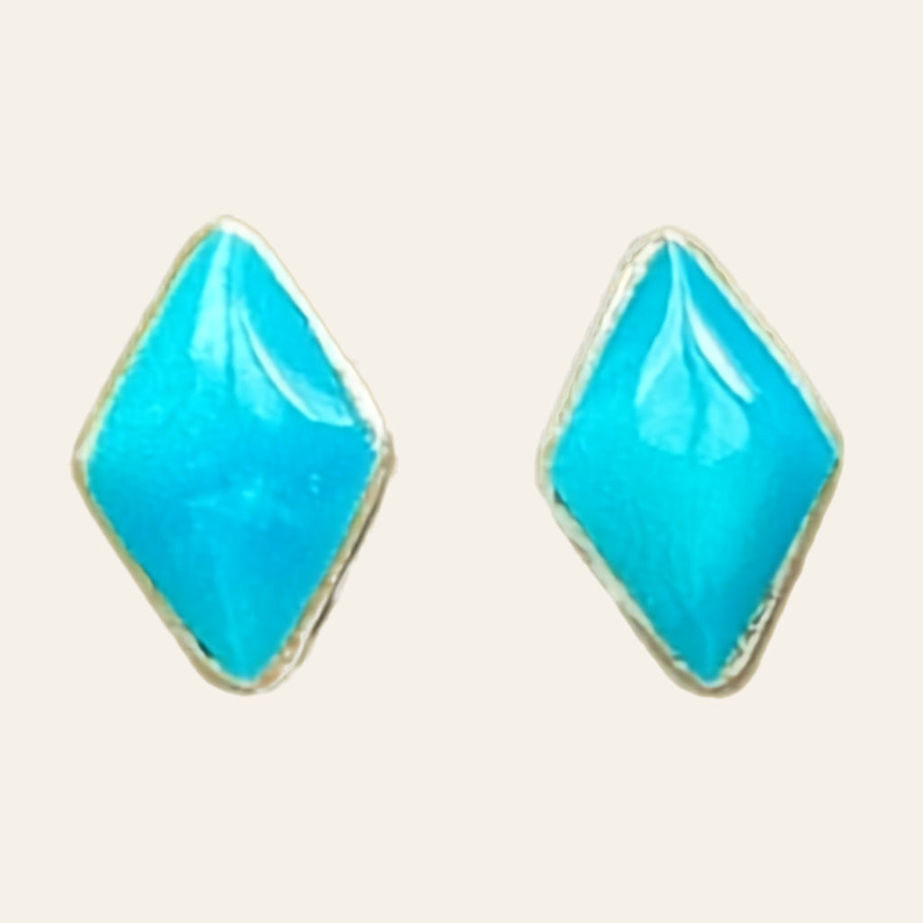 Natural Turquoise Kite Stud Earrings in Sterling Silver, shown on a cream background