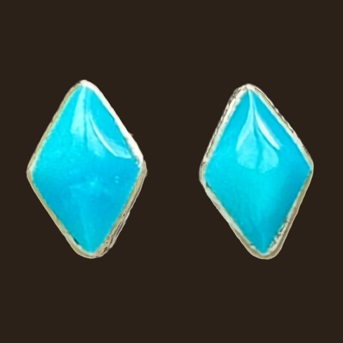 Natural Turquoise Kite Stud Earrings in Sterling Silver, shown on an espresso background