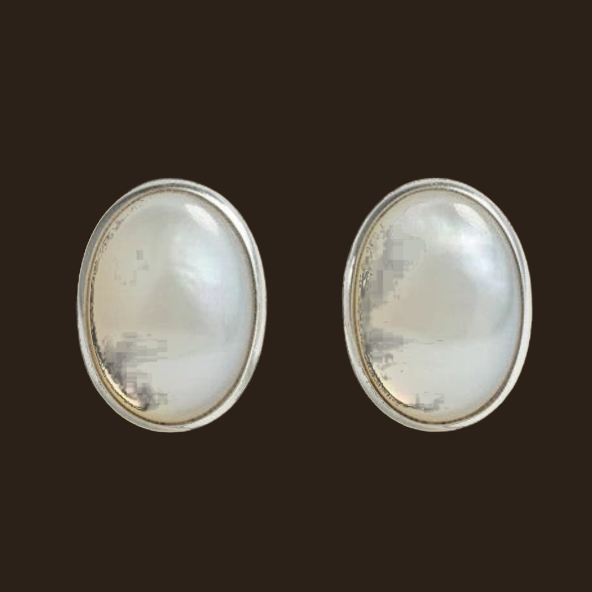 Opal Oval Stud Earrings in Sterling Silver, 7.5mm, shown on an espresso background