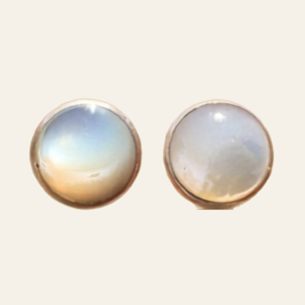 Opal Round Stud Earrings in Sterling Silver, shown on a cream background