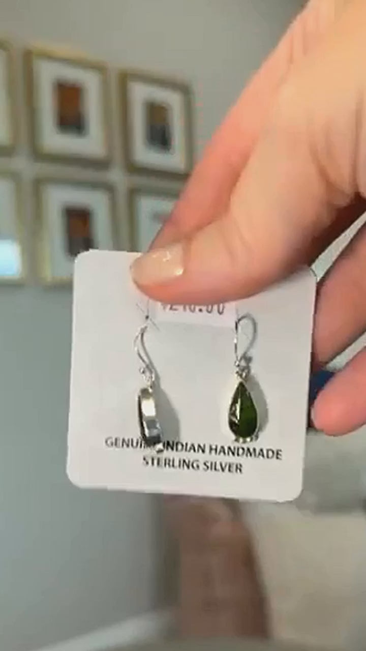 Sonoran Mountain turquoise teardrop earrings in sterling silver on the maker card