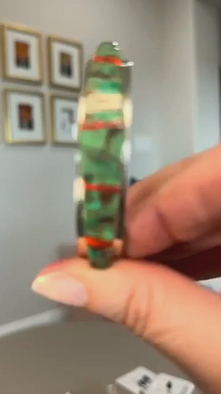 Sonoran Mountain turquoise and red opal channel inlay cuff in sterling silver, turned to show the inlay