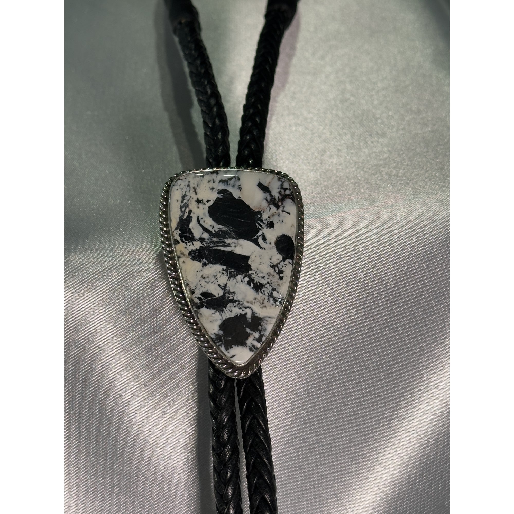 Range Crest, White Buffalo Bolo Tie, Navajo Sterling, by P Yazzie, on model