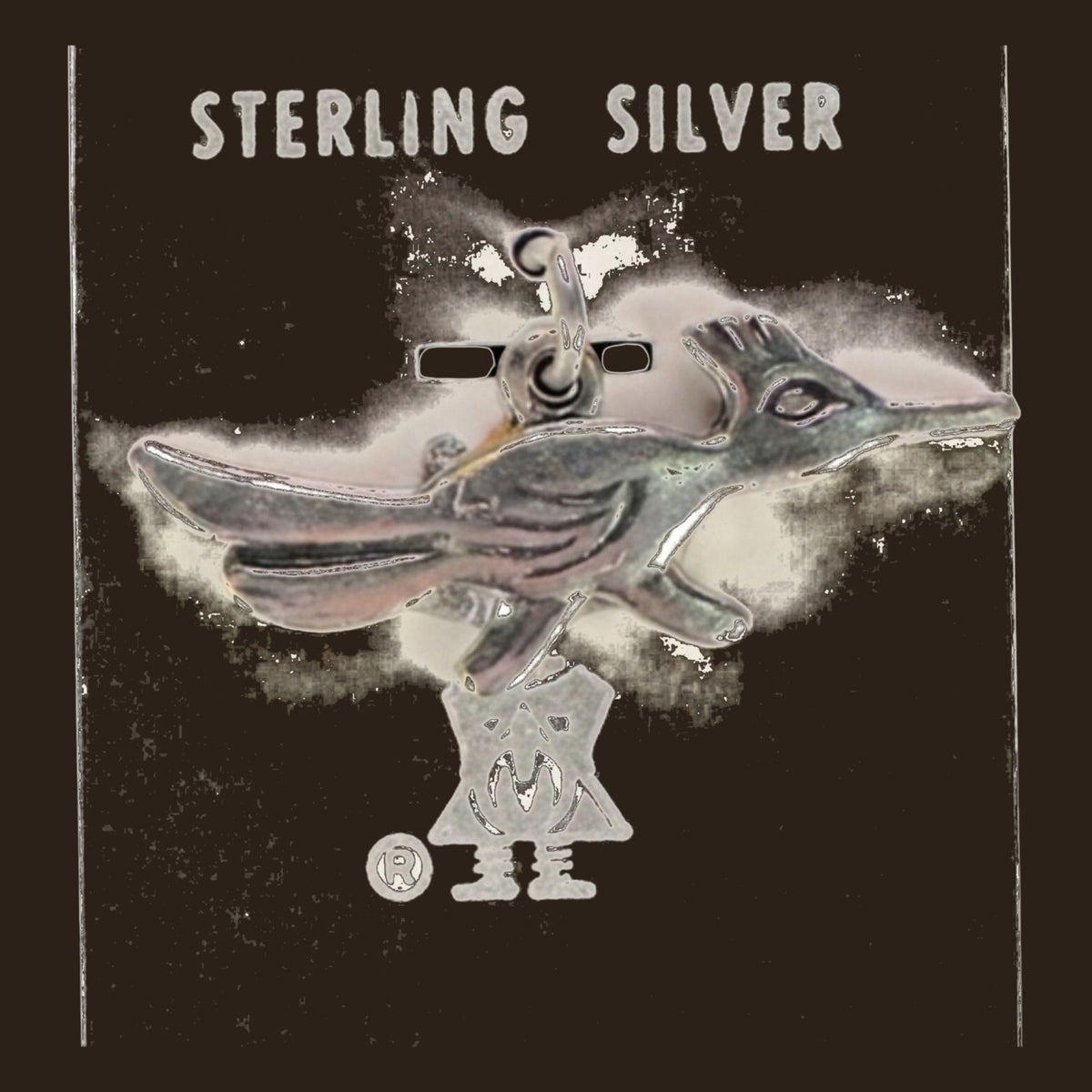 Roadrunner Charm in Sterling Silver, Vintage Maisel's New Old Stock, shown on an espresso background