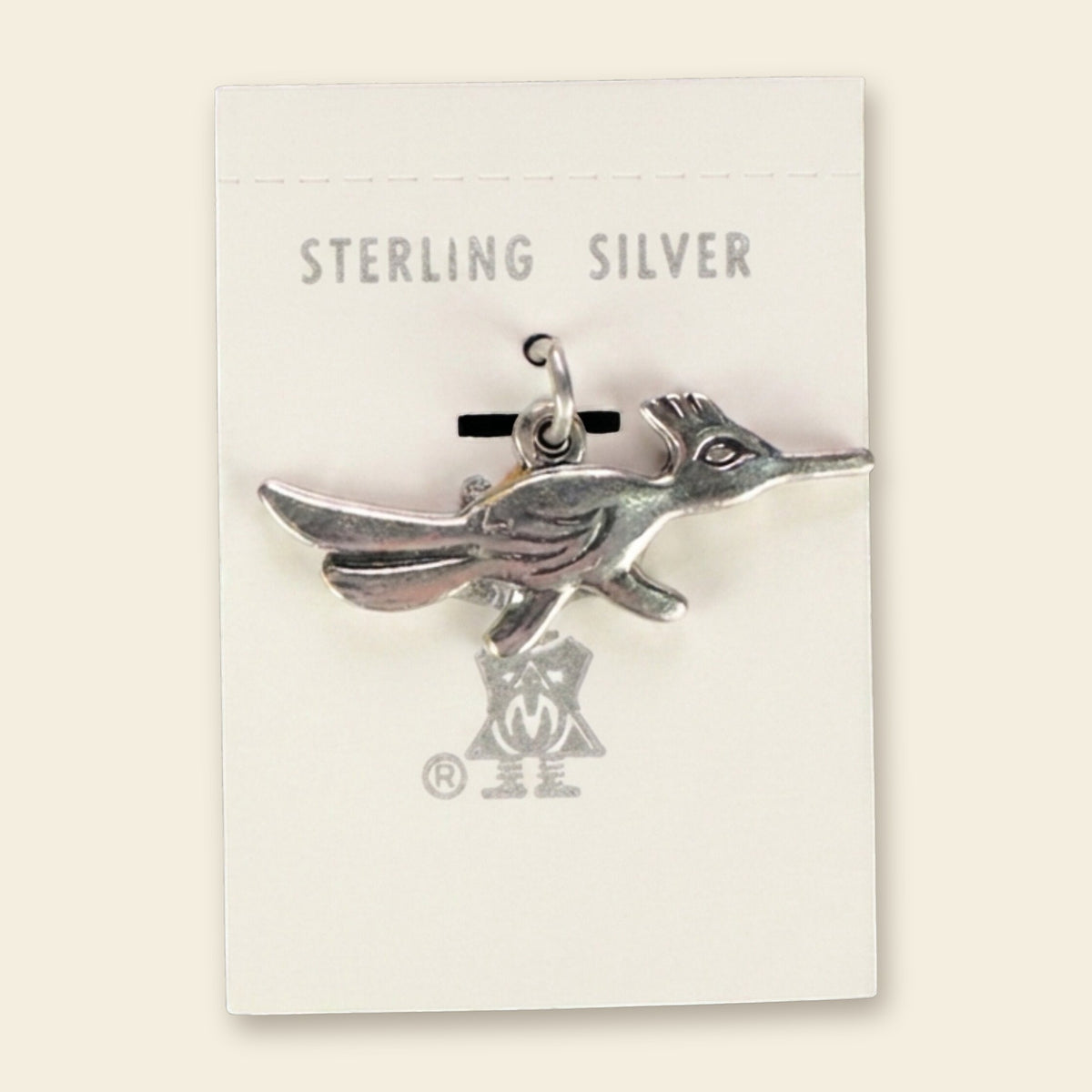 Roadrunner Charm in Sterling Silver, Vintage Maisel's New Old Stock, shown on an ivory background