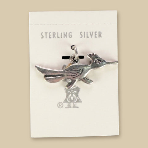 Roadrunner Charm in Sterling Silver, Vintage Maisel's New Old Stock, shown on a sand background