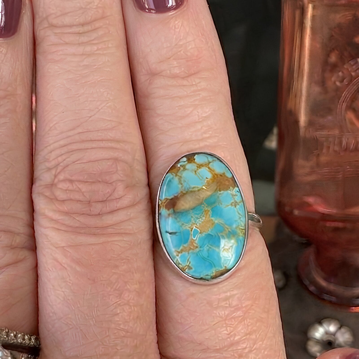 Royston turquoise ring in sterling silver worn on a finger, size 7 1/2