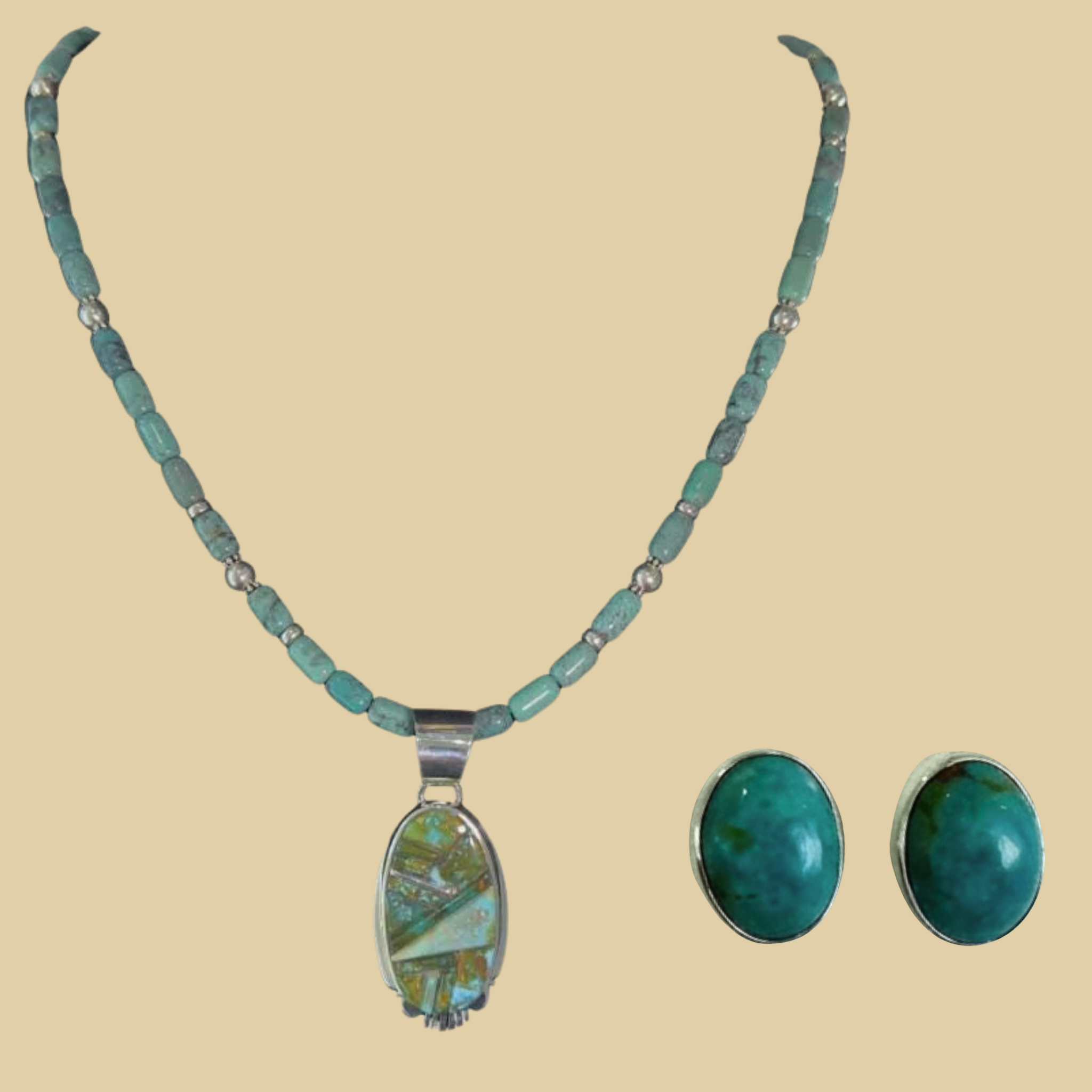 Green turquoise pendant and oval turquoise stud earrings jewelry set in sterling silver, shown on a desert plaster background