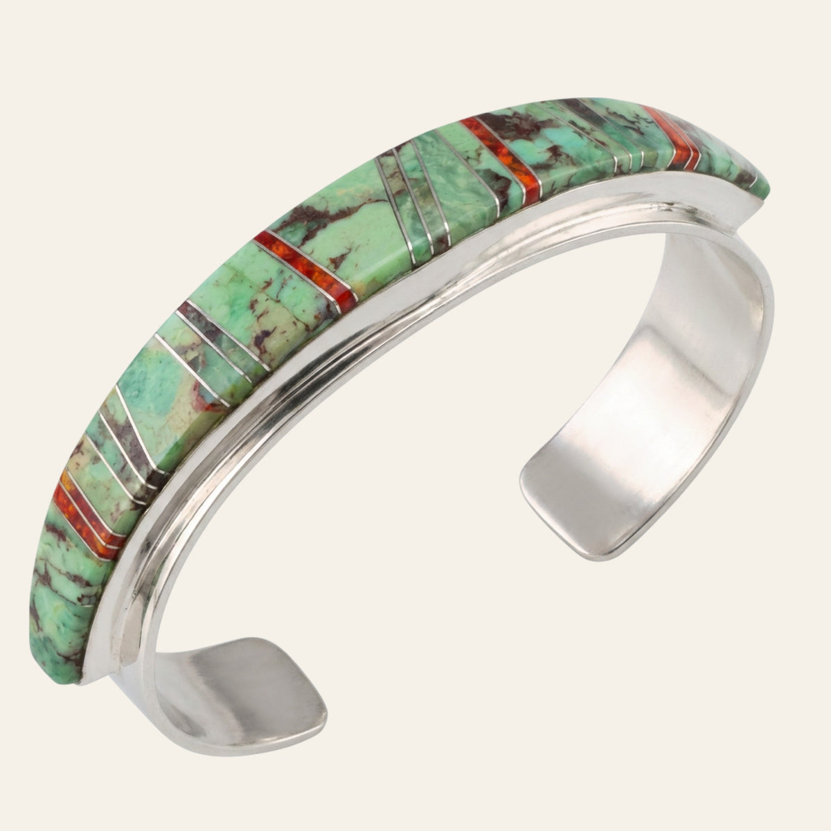 Sonoran Mountain Turquoise and Red Opal Channel Inlay Cuff in Sterling Silver, shown on a cream background