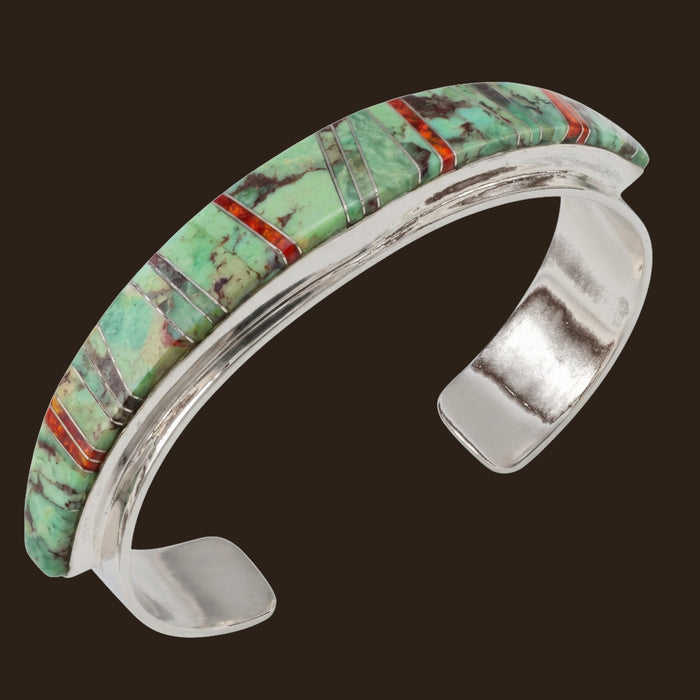Sonoran Mountain Turquoise and Red Opal Channel Inlay Cuff in Sterling Silver, shown on an espresso background